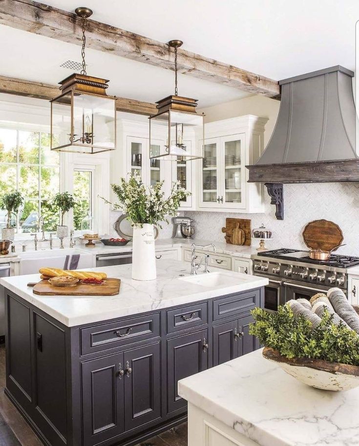 Farmhouse kitchen with dark island cabinets