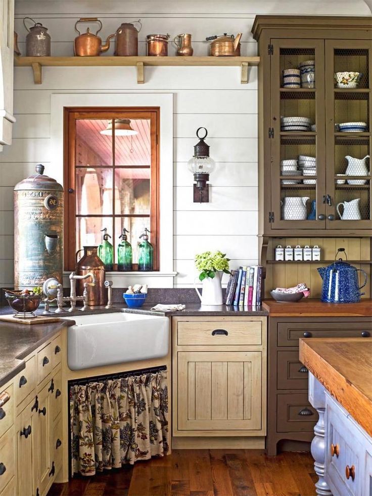 Farmhouse kitchen with vintage copper pots