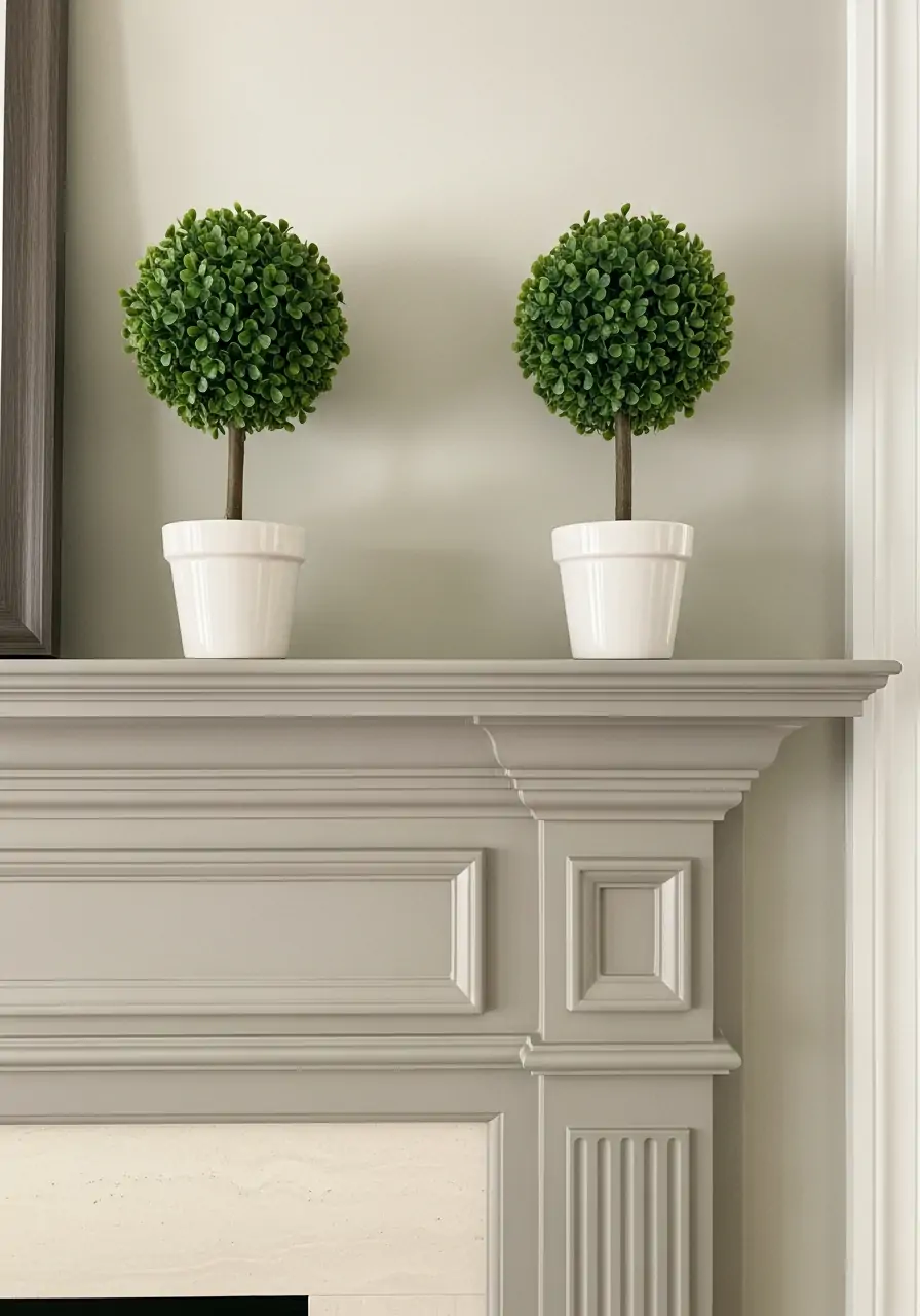 Symmetrical Mini Topiaries - spring mantel decorating ideas