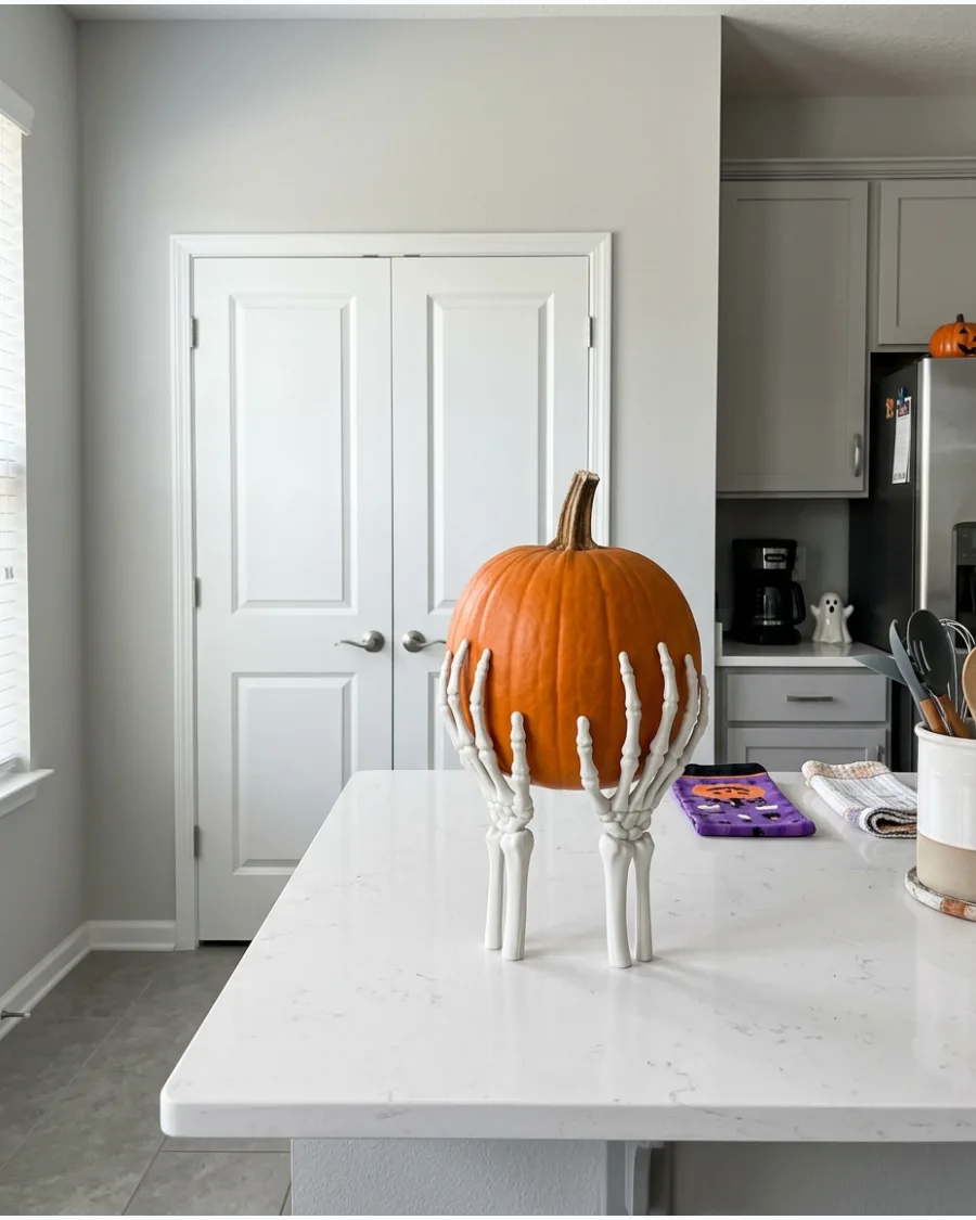 39. Skeleton Hand Pumpkin Stand