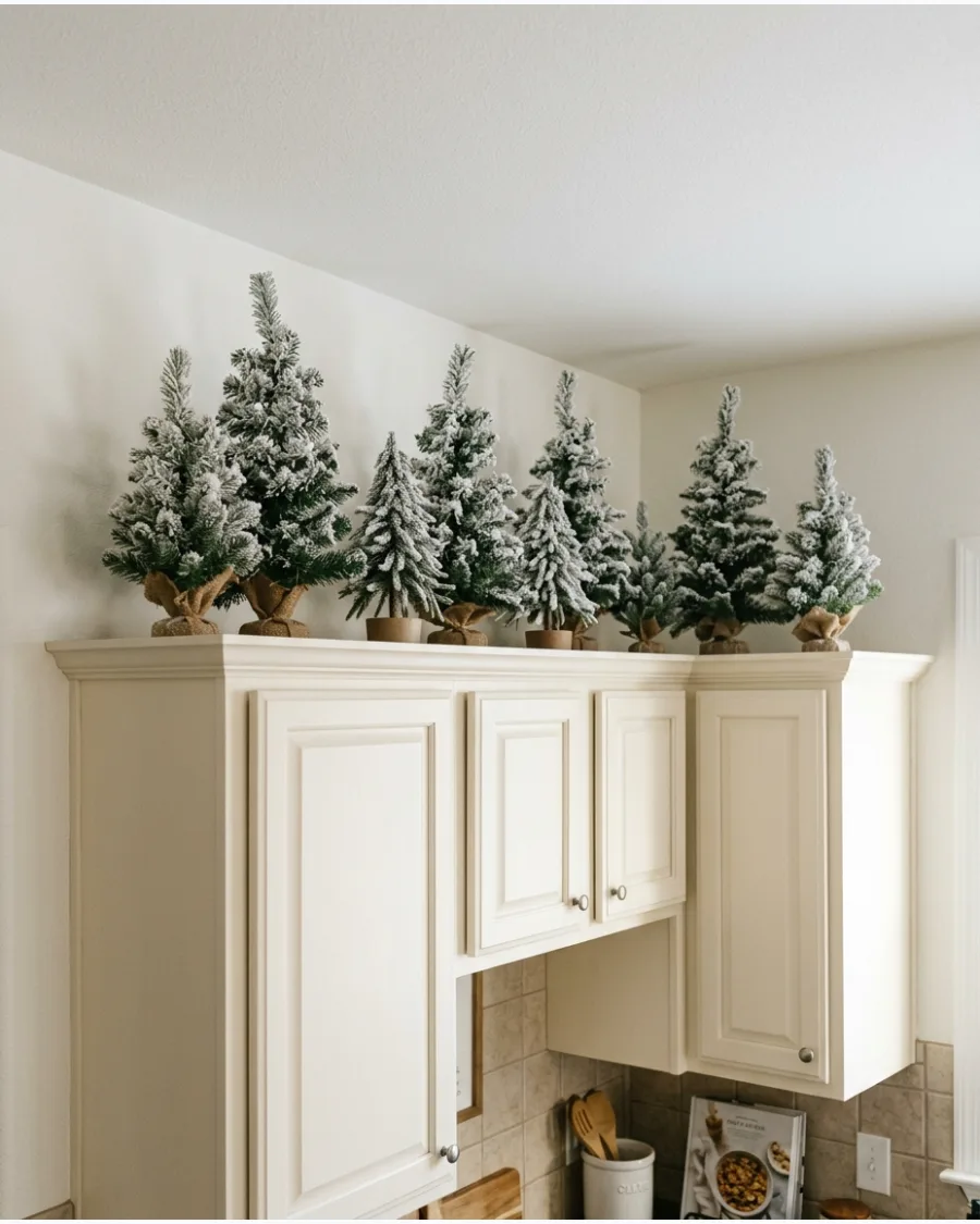 11. Flocked Mini Trees Above Cabinets