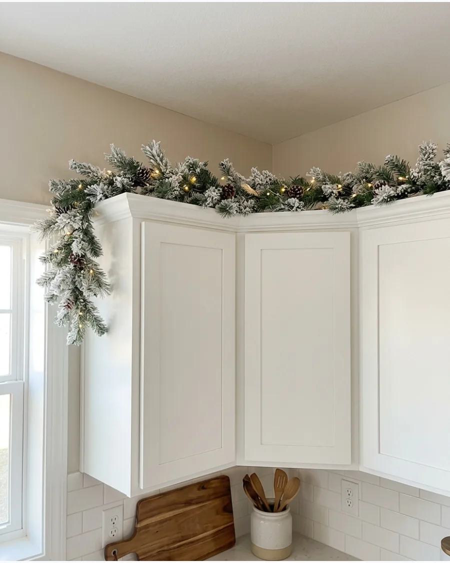 5. Flocked Greenery Above White Cabinets