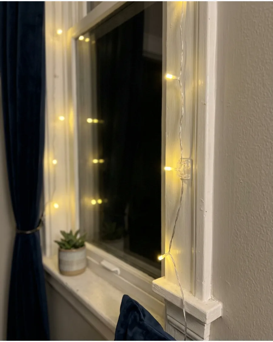 1. Warm White Lights Outlining the Window Frame