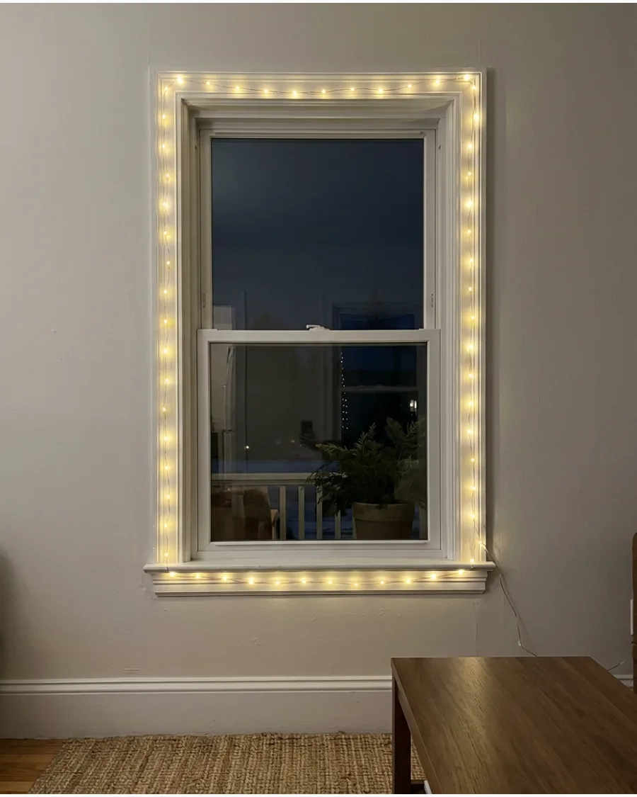 11. Warm White Fairy Lights Around the Window Frame