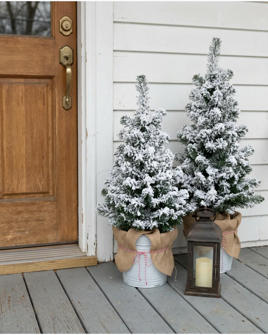 26. DIY Snowy Porch Christmas Trees