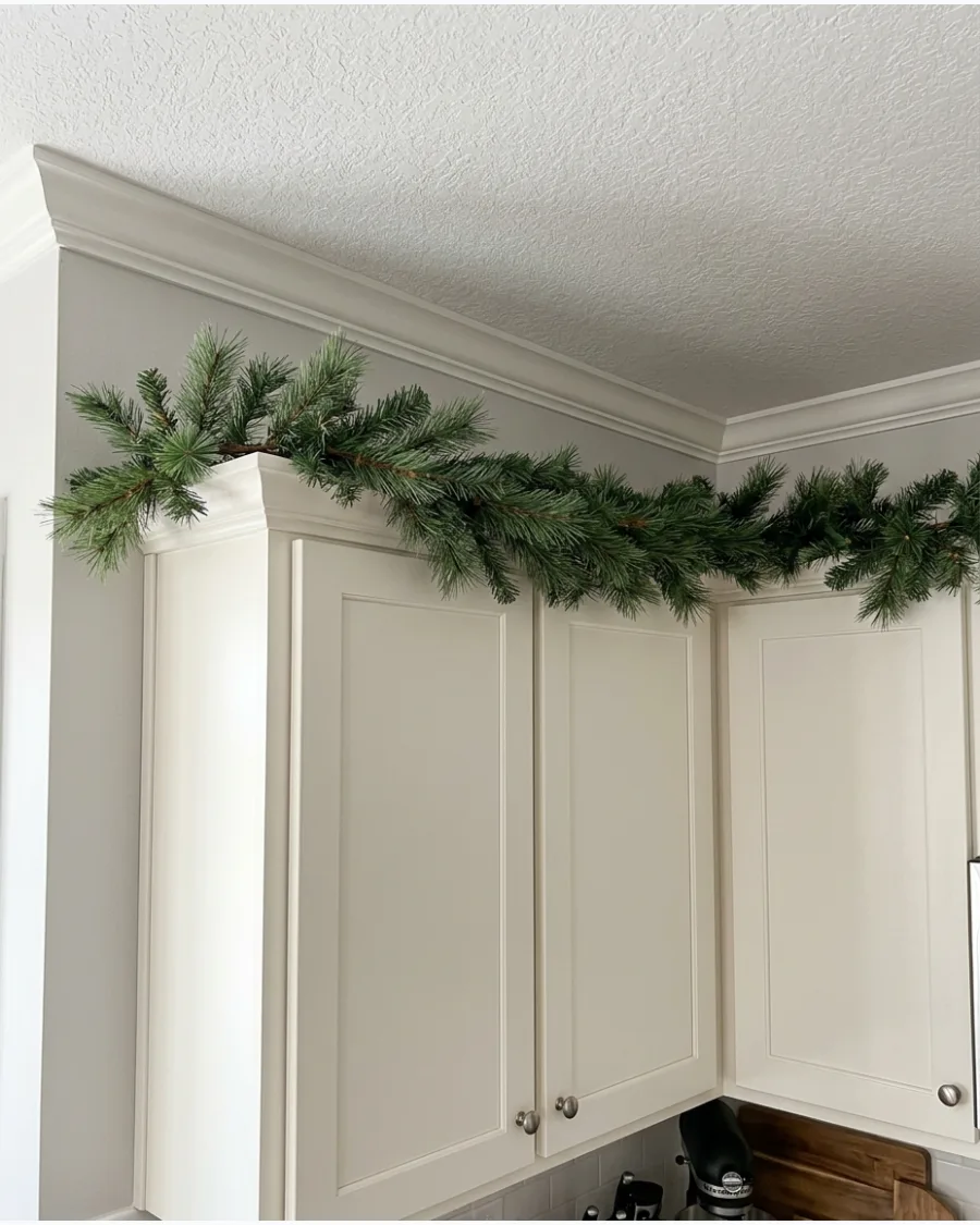 1. Simple Pine Garland Above Kitchen Cabinets