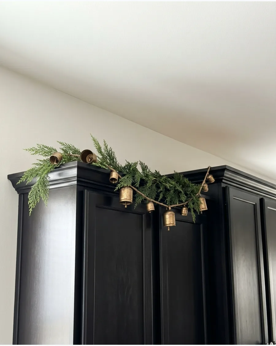 38. Mini Bell Garland Above Cabinets