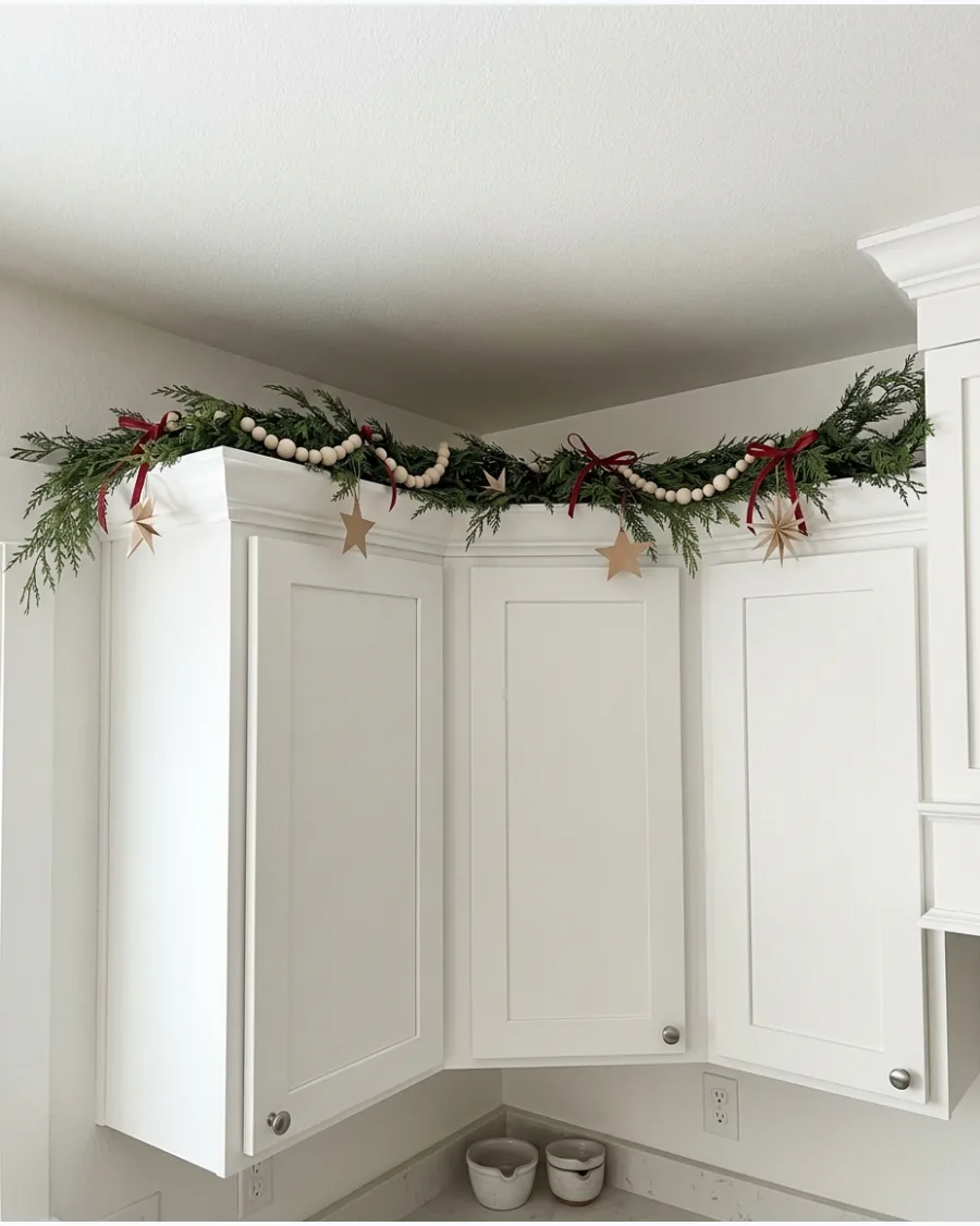 39. Scandinavian Garland Above Kitchen Cabinets