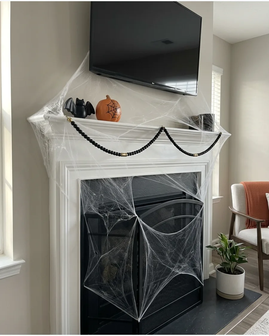 50. DIY Spiderweb Mantel