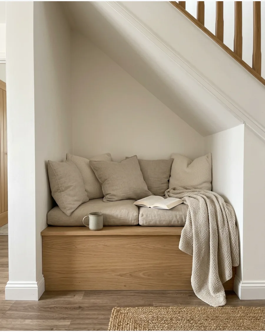 4. Neutral Reading Nook With Linen Cushions