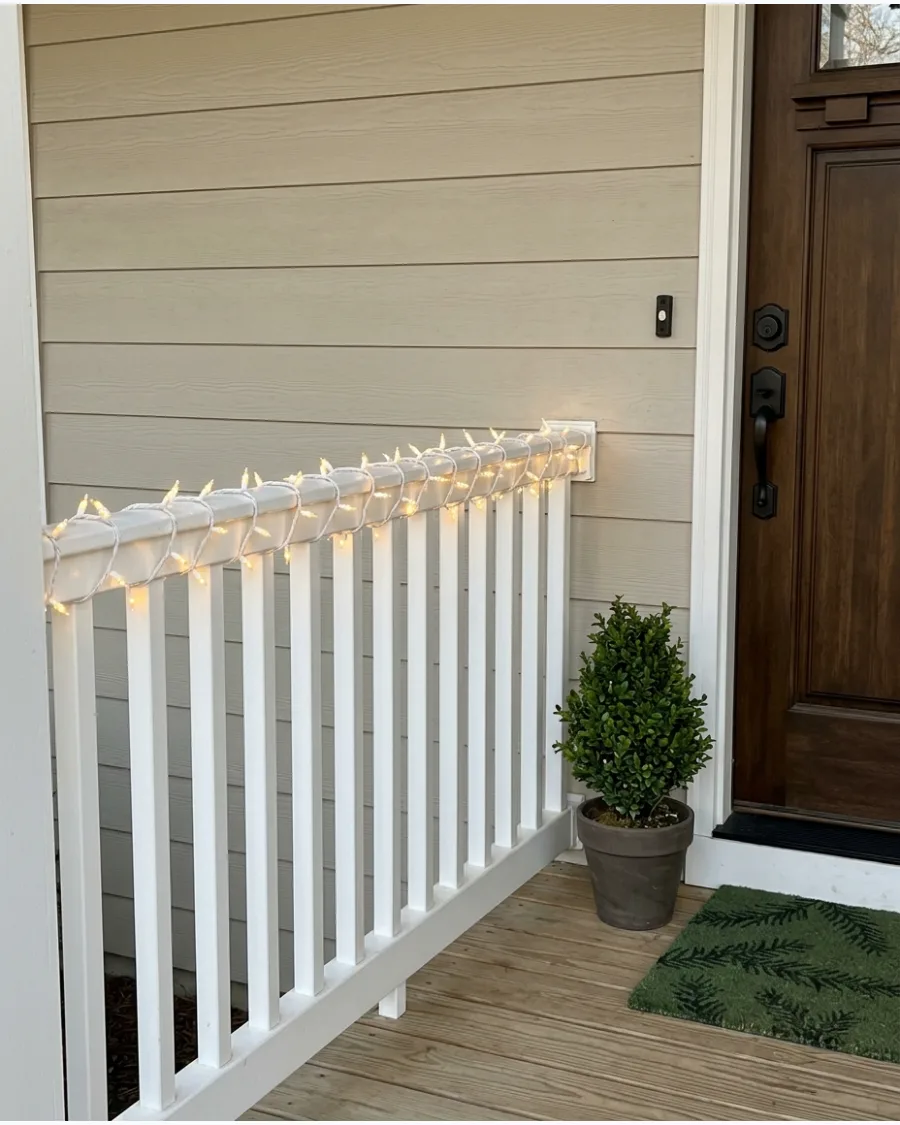 28. Warm White Lights Along the Porch Railing