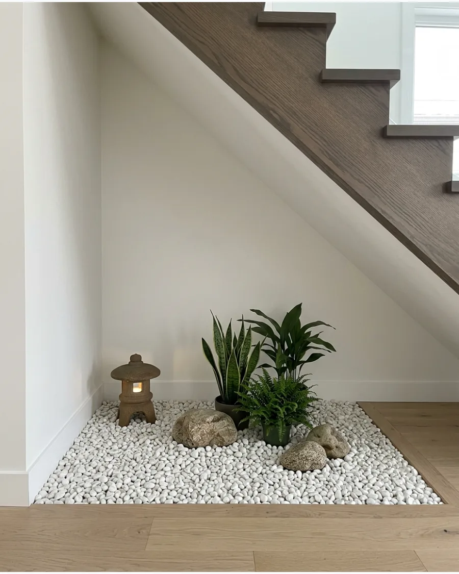 1. White Pebble Zen Garden Under Stairs