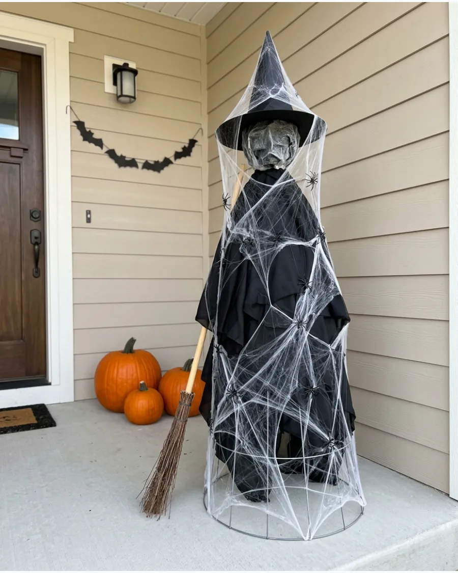 38. Spiderweb Tomato Cage Witch
