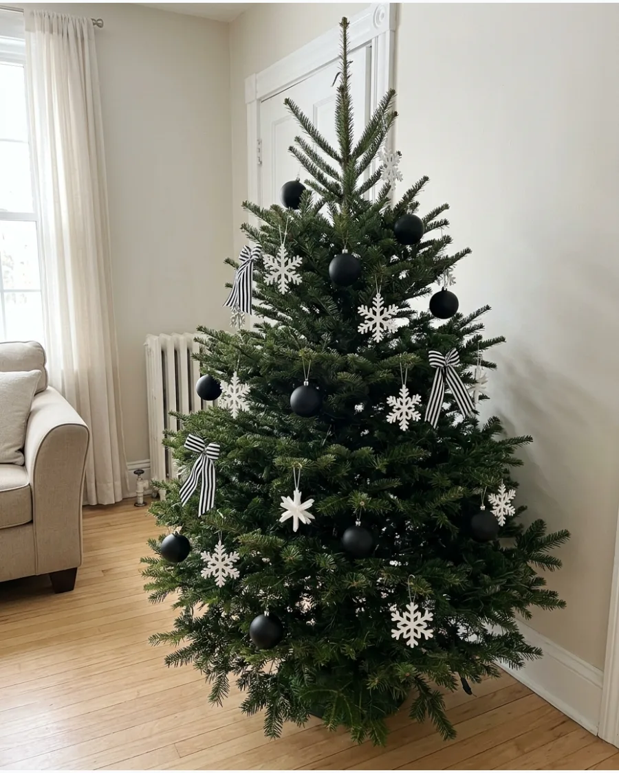 10. Black and White Christmas Tree With Greenery