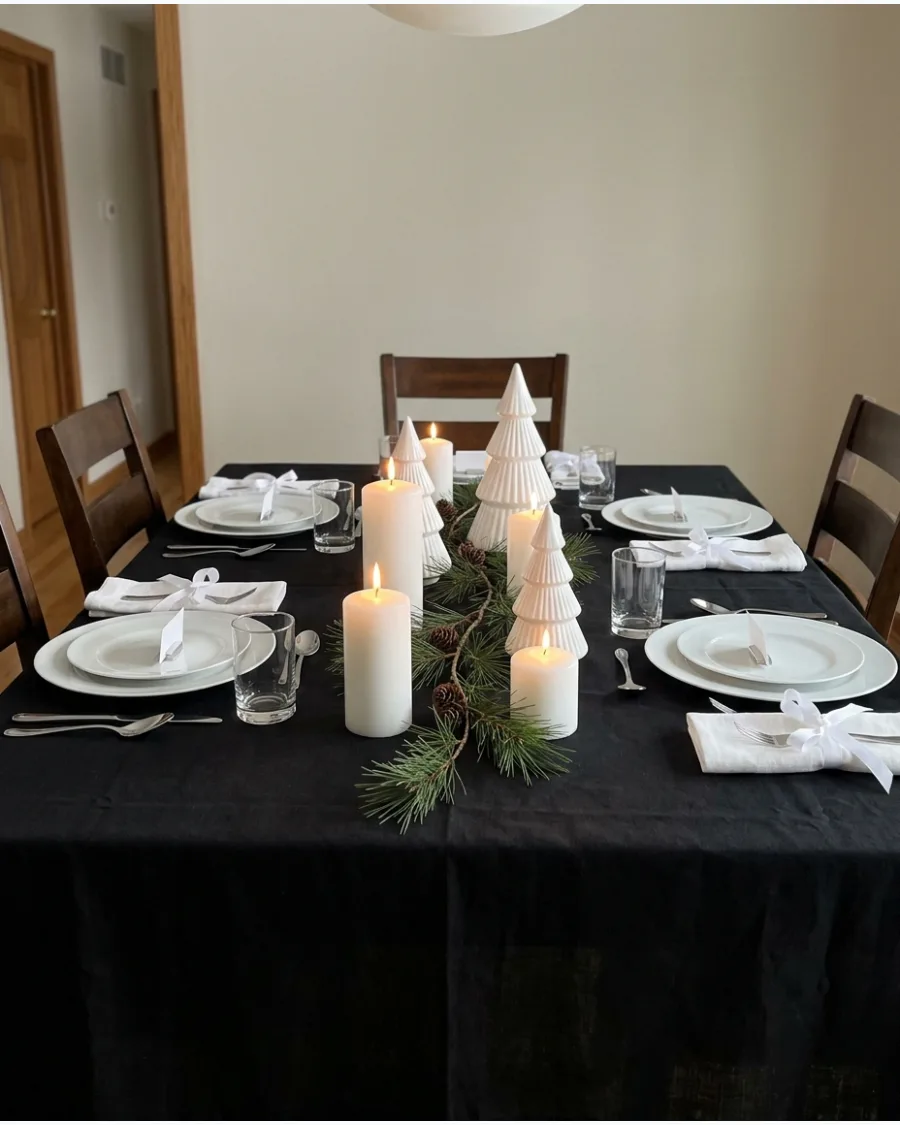 37. Black Tablecloth With White Christmas Decor