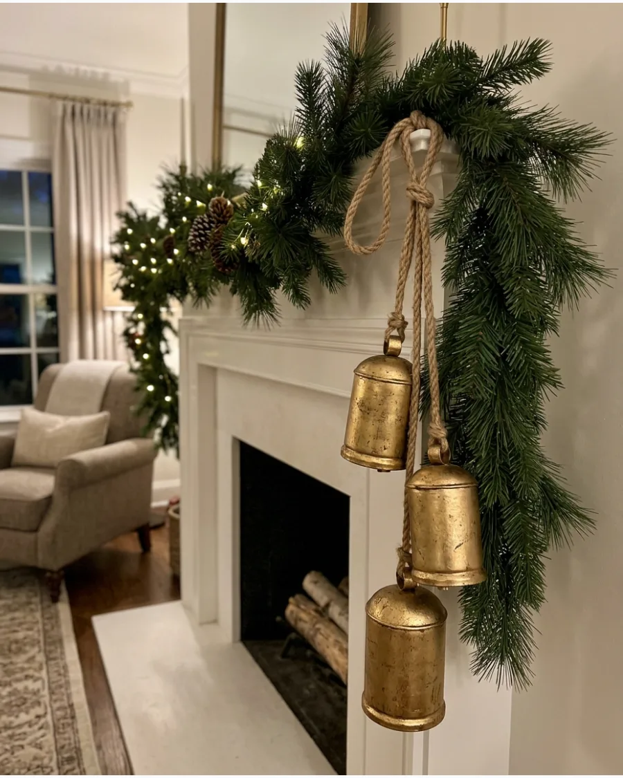 10. Large Bells Hanging From Christmas Mantel Greenery