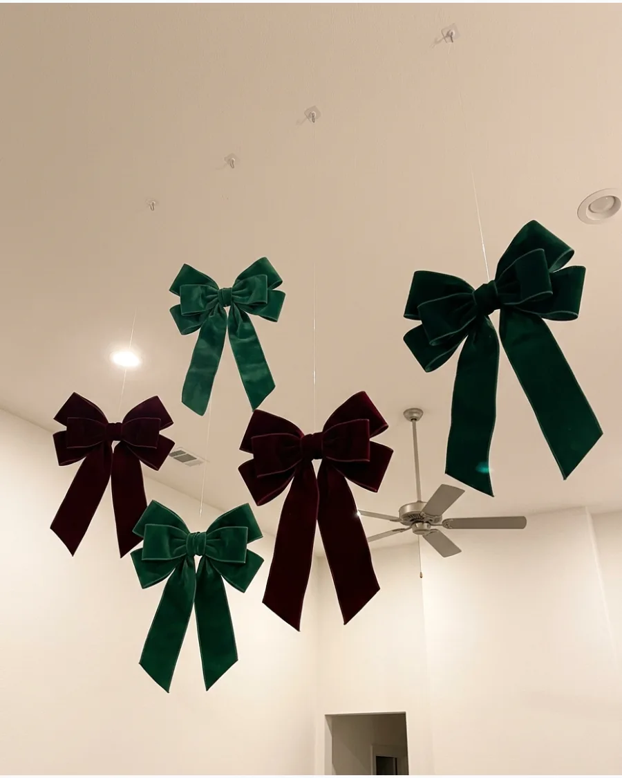 41. Oversized Velvet Bows Hanging From the Ceiling