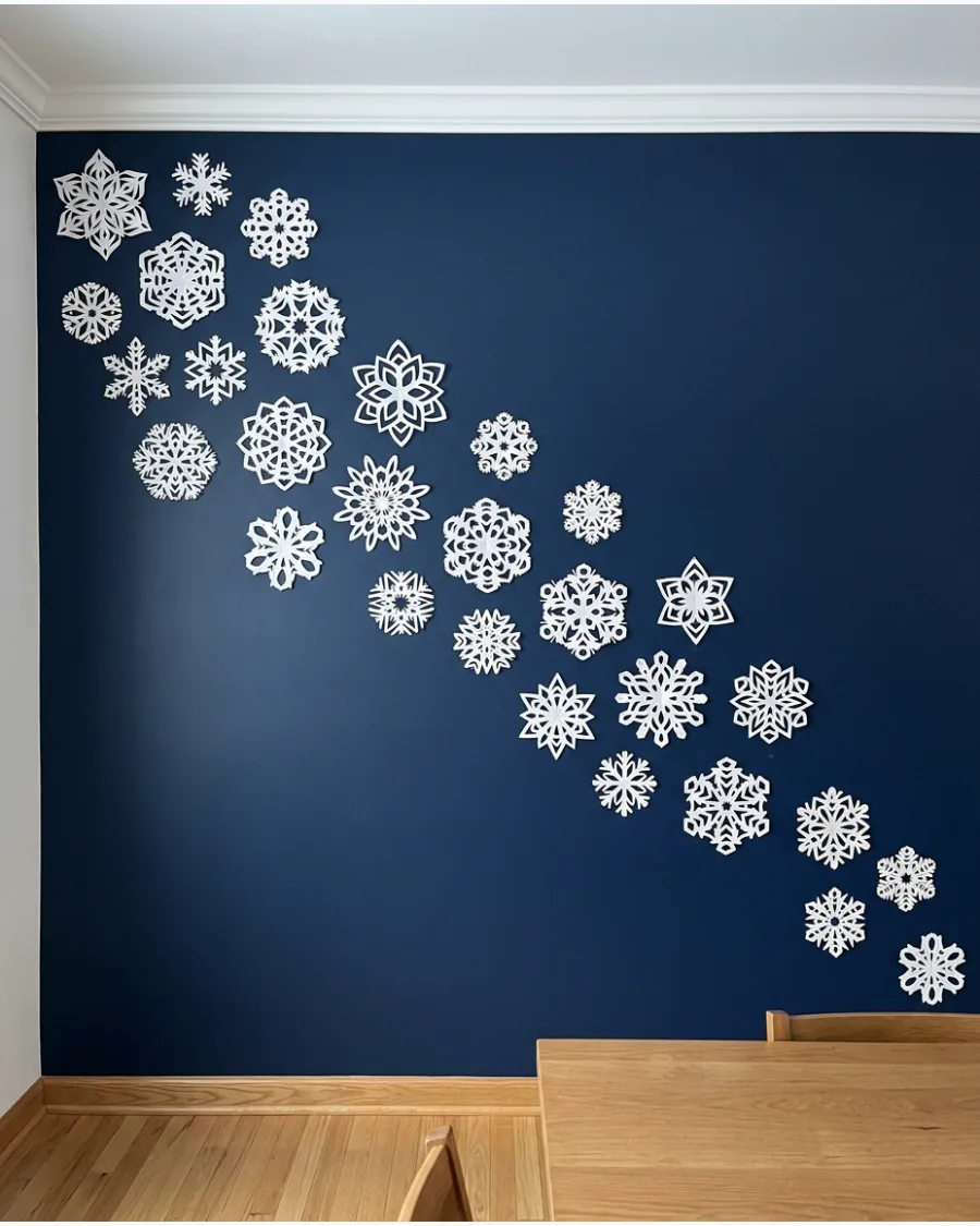 53. DIY Paper Snowflake Wall