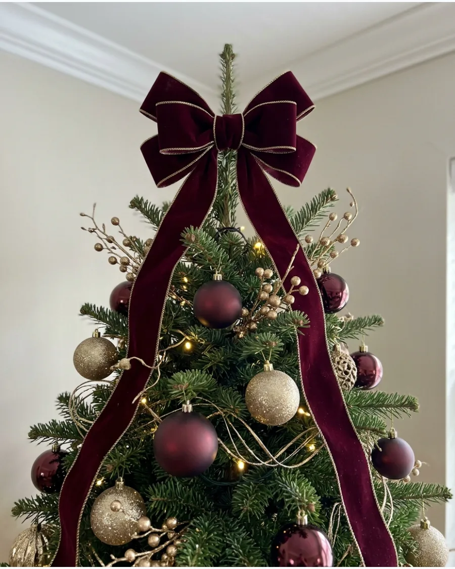 15. Burgundy Bow Tree Topper With Gold Accents