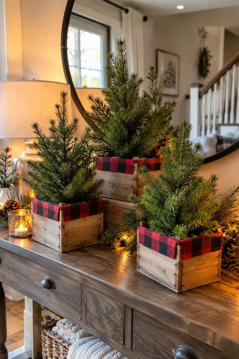 Three mini evergreen trees in wooden crates lined with buffalo check fabric